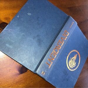 Divergent by Veronica Roth- a science fictions series for young and old. Used